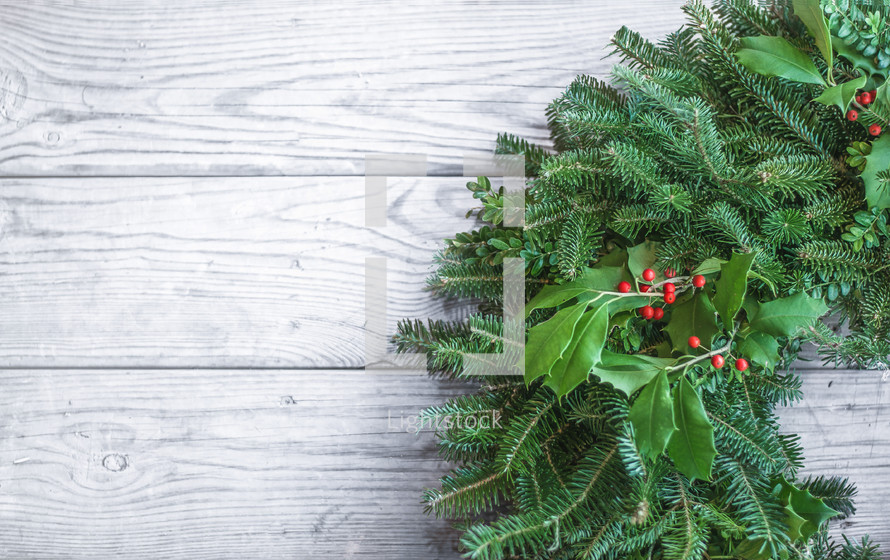 Christmas Wreath on a white wood background
