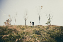 Bride and groom on a hill