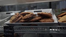 Fresh baked cookies for sale in a display case