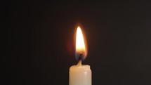 Close up of a candle being blown out