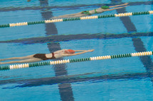 swimmers in a pool lanes 