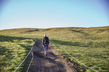 a woman walking on a trail in Iceland 