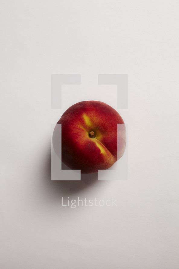 The top of a peach isolated on white