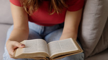 Young female christian woman reading holy book, bible. Devotional
