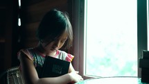Girl holding her Bible