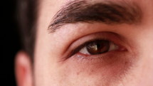 Closeup of man eye looking at camera