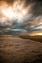 Stormy beach at sunset.