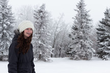 a teen girl in  winter snow 