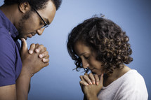 a couple praying 