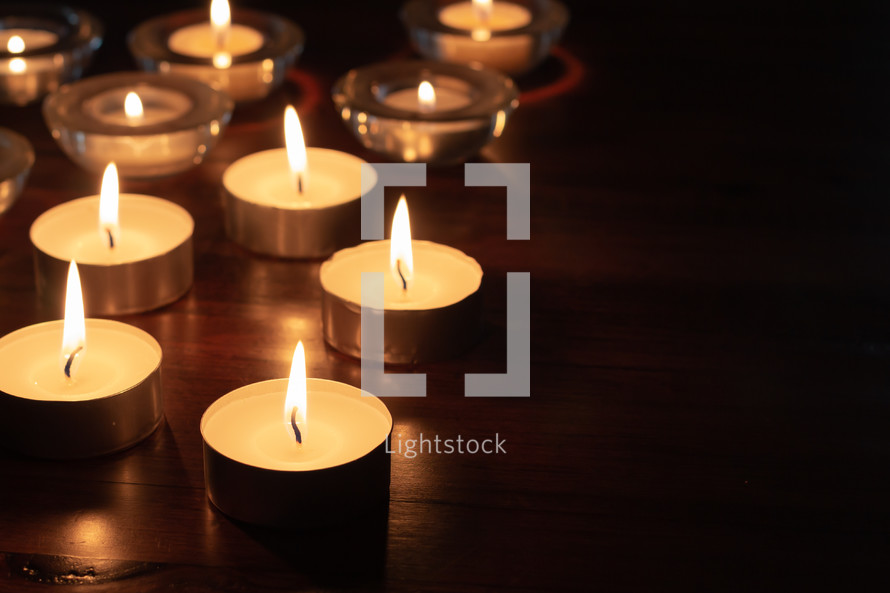 candles on a wood table 