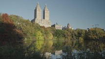 Manhattan, New York City, USA - October Central Park Lake and The San Remo Buildings during Fall Foliage