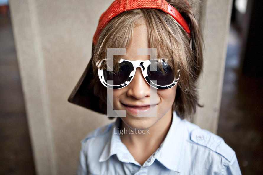 Boy wearing sunglasses and visor