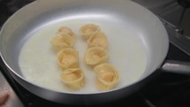 Ravioli Cooking With Butter Inside A Pan 