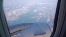 Sunset and Journey from the Airplane Window. Plane Flights Over Fluffy Clouds. Passenger window panorama view.