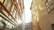 Apartment building streets in Stockholm area at winter. Scandinavian facades of old town houses in the narrow streets. Traveling concept. Slow motion. Steadicam shot.