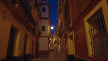 Empty Narrow Alley Street in Old Town of Sevilla at Night Seville, Spain