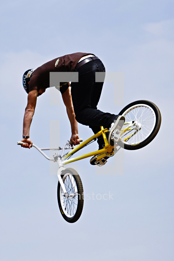 man doing stunts on a trick bike BMX x games