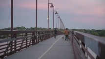 Pedestrian bridge at White Rock Lake during sunset in Dallas, Texas.
