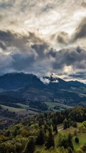 Aerial panorama of Dramatic clouds sky moving over autumn Eurupe countryside, Vertical Hyper lapse
