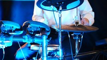 Young Man Playing Electronic Drums On Stage