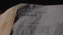 Light revealing a Bible and the Gospel of Mark