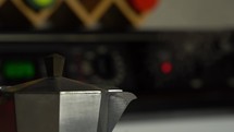 Close up of a steaming pot of coffee on the stove