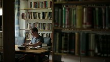 a student studying in a library 