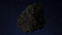 An asteroid spinning through space