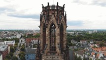 Aerial rising pan shot and close-up footage of the historical Great Saint Martin Church of Cologne, Germany.