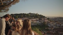 Lisbon, Portugal - People enjoy the sunset while gazing at the city of Lisbon from atop Miradouro da Graca, Lisbon Portugal