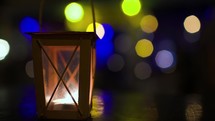 Outdoor lantern with lit candle