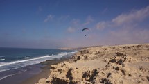 Paragliding flight freedom in ocean coast Adrenaline extreme sport