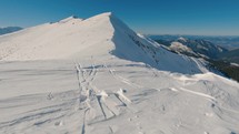 Winter mountains with ski tracks in snow, backcountry freeride skitouring snowy nature
