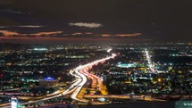 Timelapse video of Los Angeles freeway and traffic at sunset.  Shot from a city building rooftop in downtown.  