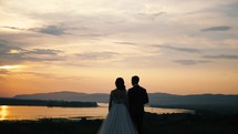 bride and groom at sunset 