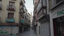 Narrow Alley Street in Old Quarter and The Cathedral Santa Iglesia Catedral Primada de Toledo Spain