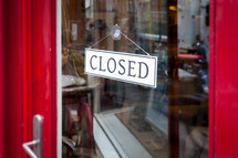 closed sign on a store door 