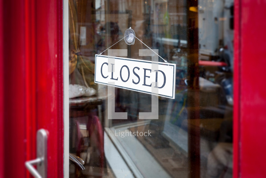closed sign on a store door 