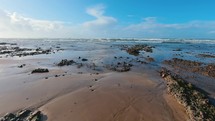 Panorama of empty beach in Morocco ocean coast in sunny summer holiday travel background