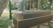 Tracking shot of an outdoor luxury kitchen.
