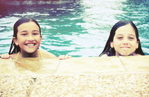 girl children swimming in a pool