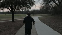 a man jogging on a trail 