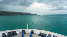 Cruise on cargo ship from harbor to the blue water in rainy morning Timelapse
