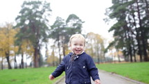 A little 2 year old boy is walking. Slow motion 50fr/sec
