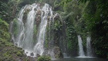 Banyu Wana Amertha Waterfall Surrounded by Lush Tropical Vegetation in Bali, Indonesia