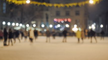 People skating on ice skating rink