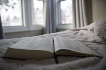 Bible on a bed 