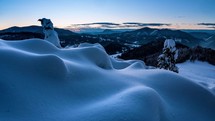 Beautiful sunrise in snowy mountains nature in cold blue winter time lapse
