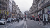 Paris, France - March 18, 2024: March Rue de Rivoli in Paris - A historic and bustling street lined with elegant arcades, luxury shops, and iconic landmarks.