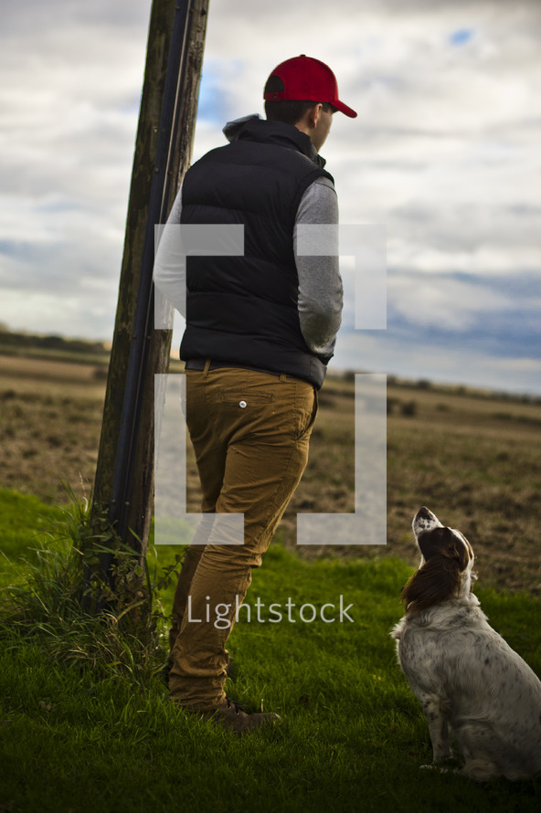 Man standing with his dog
